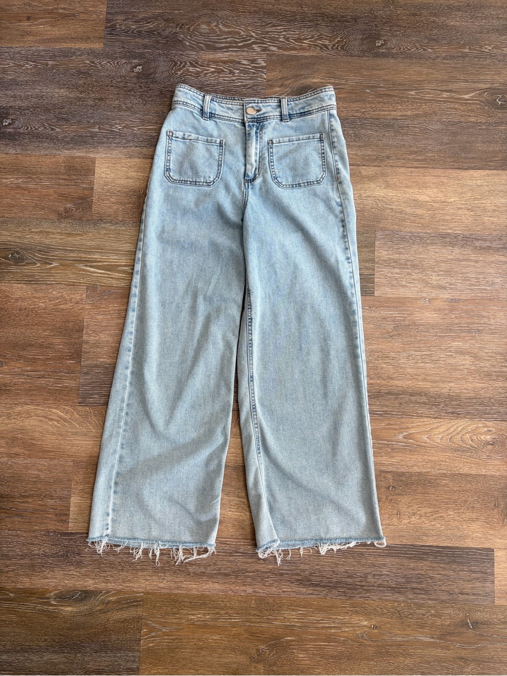 OAT New York "Cloud Luxe" High-Rise Wide-Leg Jeans in a light blue raw hem 4/27
